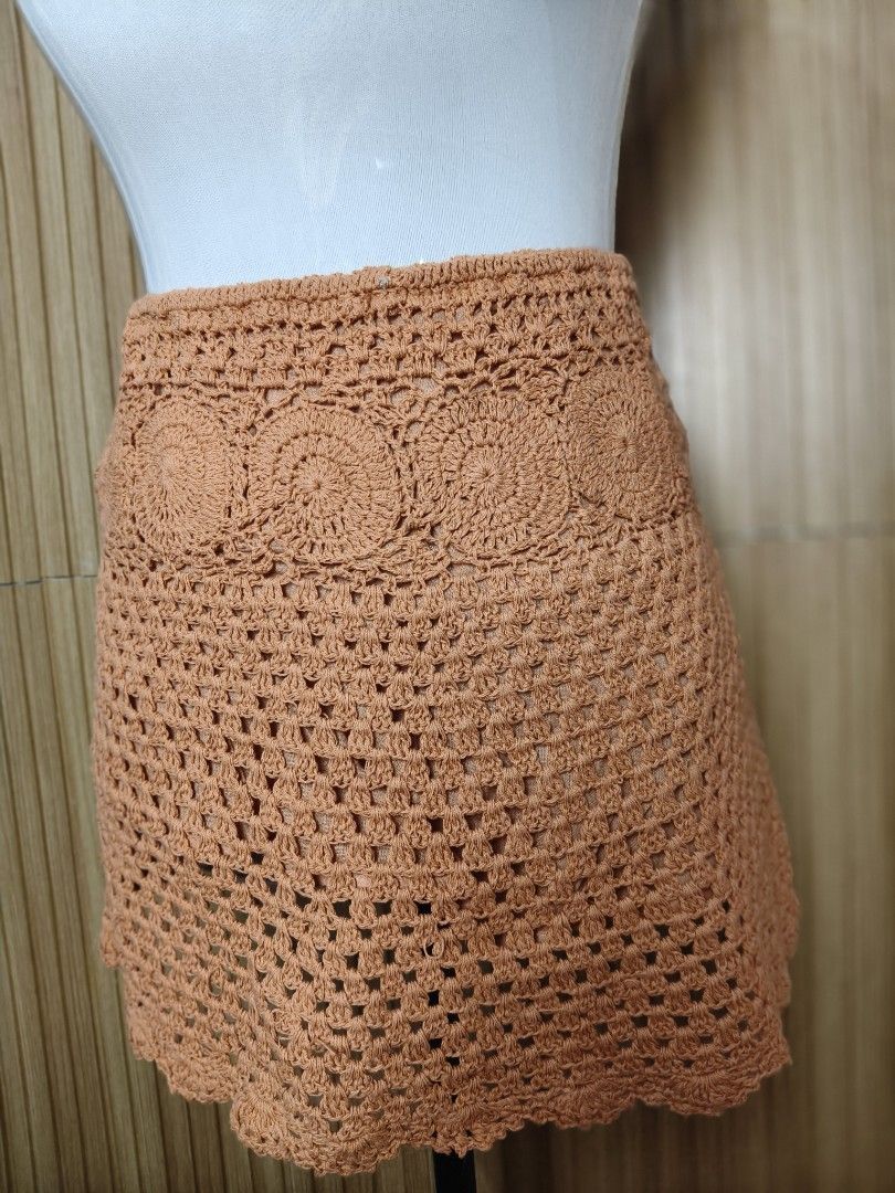 Pull&Bear Crochet Orange Mini Skirt (Category: Skirts) located in Taguig. Submitted by ashie_clothing (Listing ID 1470366993, Image 3). Description: - Brand: Pull&Bear - Item: Crochet Mini Skirt - Color: Rich Orange - Size: S (Brand New With Tags) - Details: Circular crochet pattern, open-knit lower body, and scalloped hem - Lining: Includes inner lining for comfort.