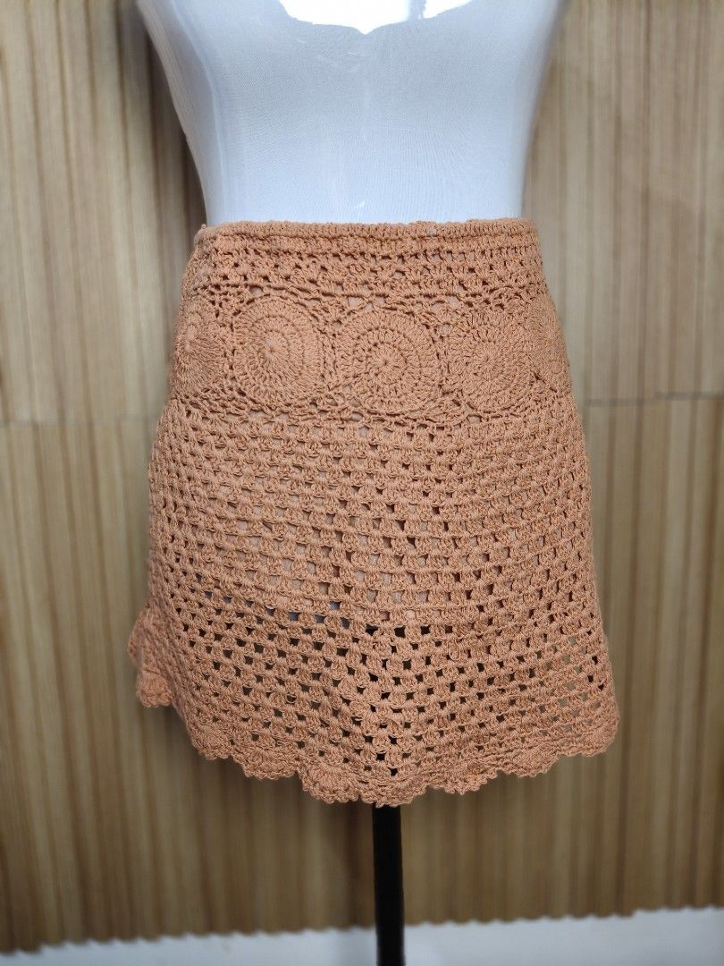 Pull&Bear Crochet Orange Mini Skirt (Category: Skirts) located in Taguig. Submitted by ashie_clothing (Listing ID 1470366993, Image 2). Description: - Brand: Pull&Bear - Item: Crochet Mini Skirt - Color: Rich Orange - Size: S (Brand New With Tags) - Details: Circular crochet pattern, open-knit lower body, and scalloped hem - Lining: Includes inner lining for comfort.