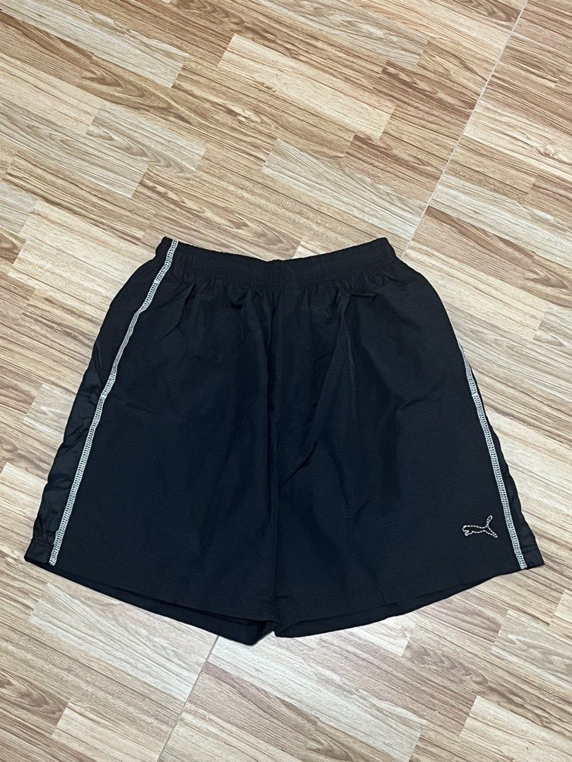 Puma Black Athletic Shorts Size M (Category: Activewear) located in Marikina City. Submitted by _bananahanaa (Listing ID 1470513203, Image 1). Description: - Brand: Puma - Color: Black with white contrast stitching - Size: Medium (M) - Features: Elastic waistband, side pockets, and comfortable mesh lining - Details: Logo embroidery near the hem and large Puma wordmark on the back right leg - Condition: Clean overall - fits small-medium frames - i