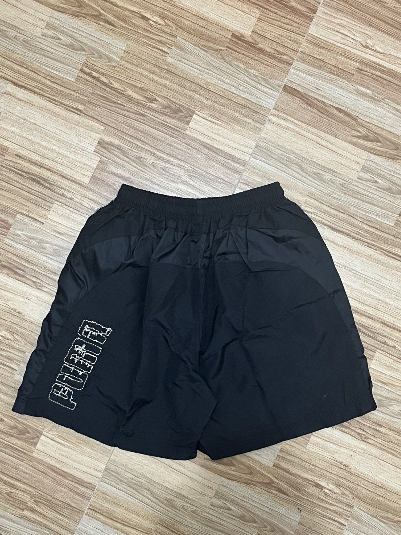 Puma Black Athletic Shorts Size M (Category: Activewear) located in Marikina City. Submitted by _bananahanaa (Listing ID 1470513203, Image 2). Description: - Brand: Puma - Color: Black with white contrast stitching - Size: Medium (M) - Features: Elastic waistband, side pockets, and comfortable mesh lining - Details: Logo embroidery near the hem and large Puma wordmark on the back right leg - Condition: Clean overall - fits small-medium frames - i