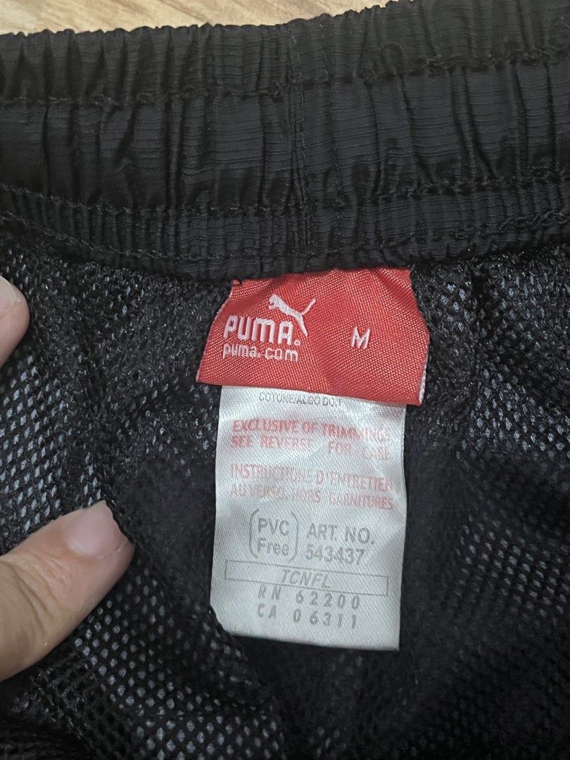 Puma Black Athletic Shorts Size M (Category: Activewear) located in Marikina City. Submitted by _bananahanaa (Listing ID 1470513203, Image 3). Description: - Brand: Puma - Color: Black with white contrast stitching - Size: Medium (M) - Features: Elastic waistband, side pockets, and comfortable mesh lining - Details: Logo embroidery near the hem and large Puma wordmark on the back right leg - Condition: Clean overall - fits small-medium frames - i