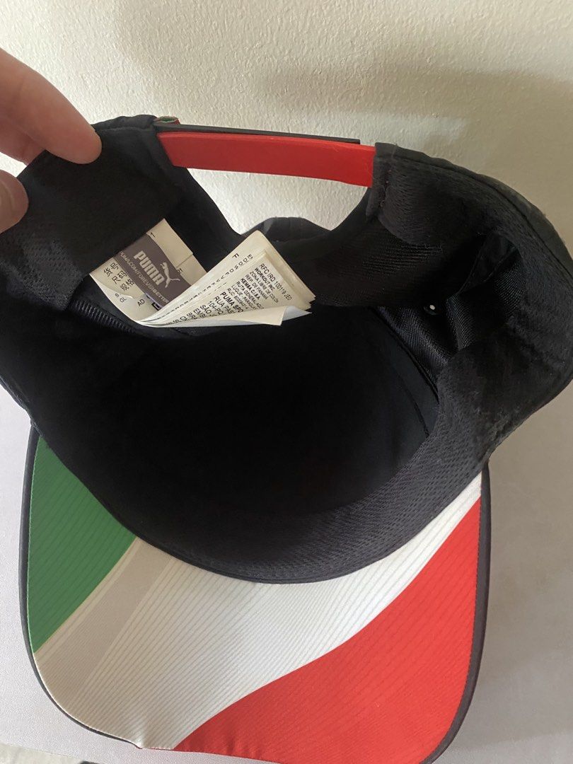 Puma Ferrari Scuderia Cap (Category: Caps & Hats) located in Manila. Submitted by primomirp (Listing ID 1470411746, Image 3). Description: - Brand: Puma x Scuderia Ferrari - Color: Black and red with Italian flag tricolor stripes - Logos: Embroidered Puma jumping cat on the back - Details: Tricolor undervisor panels (green, white, red) - Closure: Adjustable snapback with tricolor accent.