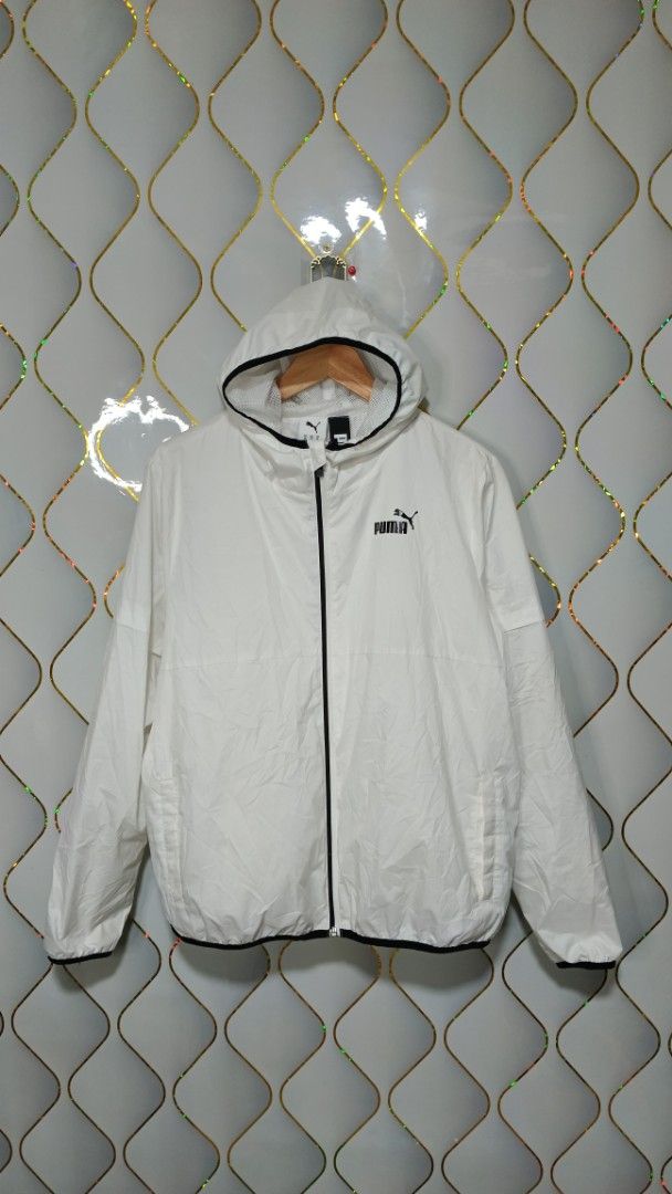Puma White Hooded Windbreaker Jacket (Category: Coats, Jackets and Outerwear) located in Manila. Submitted by zariyah.1986 (Listing ID 1470463042, Image 1). Description: - Brand: Puma - Item: Hooded windbreaker jacket - Color: White with black zip and trim details - Size: XL (Tag measurements: 24" width x 25" length) - Condition: Lightweight layer, great for daily wear - Features: Full zip closure, adjustable hood, breathable mesh interior lining
