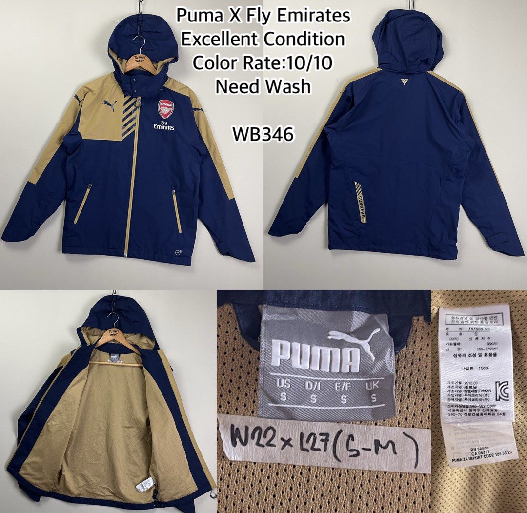 Puma X Fly Emirates Arsenal Jacket (Category: Coats, Jackets and Outerwear) located in Malaybalay. Submitted by toffee_s_thrift0.1 (Listing ID 1470520546, Image 1). Description: - Brand: Puma x Fly Emirates Arsenal - Colorway: Navy Blue and Gold - Features: Full zip front, hood, and breathable mesh interior lining - Details: Arsenal club crest and Puma branding on chest, Gunners text on back - Size: Tagged Small (US, D/I, E/F, UK) - Measurements: