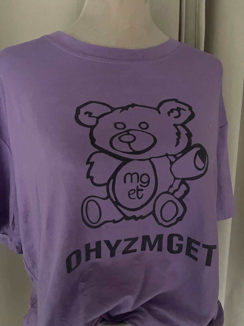 Purple Oversized bear (Category: Shirts) located in Cainta. Submitted by zlove111 (Listing ID 1470455611, Image 3). Description: - Color: Purple with black bear graphic and 'OHYZMGET' text - Fit: Relaxed, oversized fit for ultimate comfort - Material: Soft and breathable cotton - Neckline: Classic round neckline - Style: Versatile casual wear, easy to pair with jeans or shorts 23" .