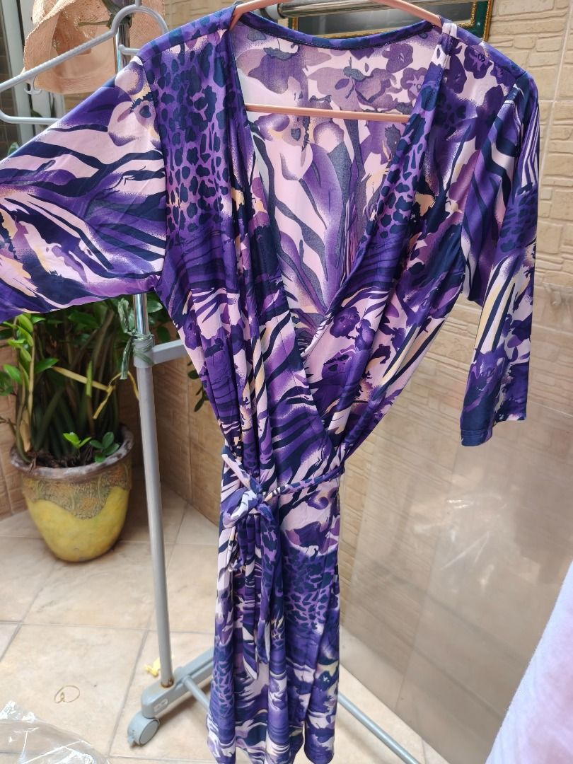 Purple Patterned Wrap around Dress With Tie Belt (Category: Dresses) located in Manila. Submitted by olxph_674182959 (Listing ID 1470362596, Image 1). Description: - Style: V-neck wrap dress with matching waist tie - Print: Chic mixed animal and floral design - Sleeves: Three-quarter length - Material: Lightweight, breathable, and easy to slip on - Fit: Adjustable wrap style for a custom fit - Occasion: Perfect for casual wear, dates, or weekend 