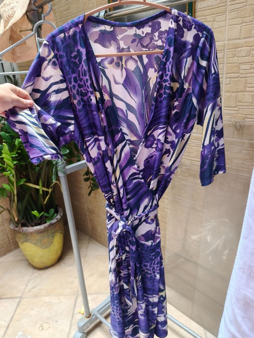 Purple Patterned Wrap around Dress With Tie Belt (Category: Dresses) located in Manila. Submitted by olxph_674182959 (Listing ID 1470362596, Image 2). Description: - Style: V-neck wrap dress with matching waist tie - Print: Chic mixed animal and floral design - Sleeves: Three-quarter length - Material: Lightweight, breathable, and easy to slip on - Fit: Adjustable wrap style for a custom fit - Occasion: Perfect for casual wear, dates, or weekend 