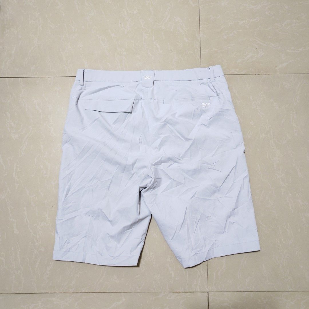 PXG Men's Golf Shorts Bundle Size XL (Category: Shorts) located in Manila. Submitted by ryandip88861707 (Listing ID 1470454695, Image 3). Description: Bundle of two pairs of PXG golf shorts. One light grey, one navy blue. Size XL. Made from polyester and elastane blend, super stretchy and comfortable for the course. Multiple pockets front and back. Clean condition, no stains or damage found. Great for hot weather on the green..
