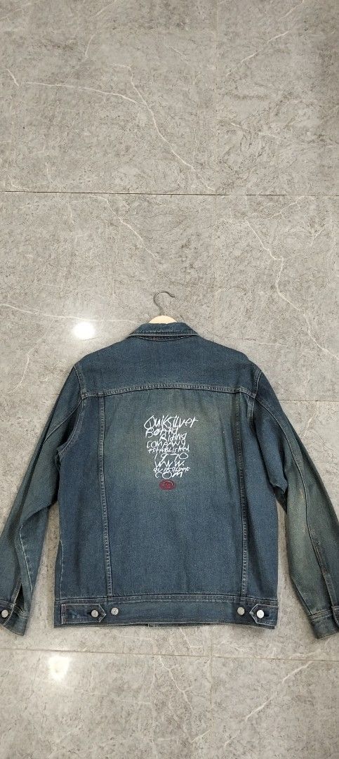 Quiksilver Denim Jacket Size M Vintage Blue (Category: Coats, Jackets and Outerwear) located in Bacolod City. Submitted by hurleydediamante0513 (Listing ID 1470377759, Image 3). Description: - Brand: Quiksilver - Style: Vintage denim jacket, solid streetwear piece - Color: Blue - Material: Cotton - Size: M on tag (fits chest size 95cm) - Features: Classic button-up front, chest flap pockets, graphic print, and embroidered branding patch on the ba