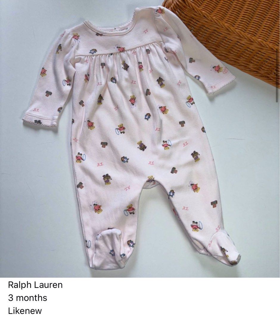 Ralph Lauren Baby Bear Romper 3 Months (Category: Babies & Kids Fashion) located in Manila. Submitted by miamoire (Listing ID 1470556761, Image 1). Description: - Brand: Ralph Lauren - Color: Pink with all-over Polo Bear print and RL lettering - Size: Fits babies around 3 months old - Material: Super soft 100% cotton - Features: Long sleeves, rounded neckline, gathered bodice, and built-in feet - Condition: Great for everyday wear .