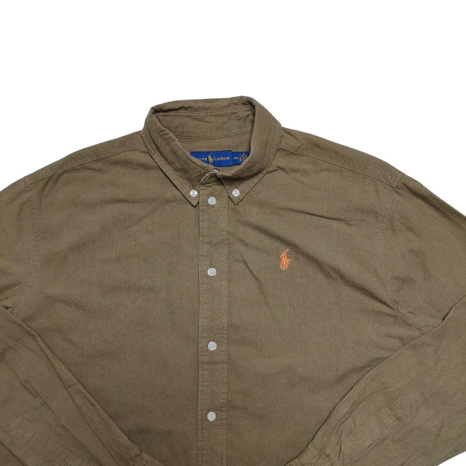 Ralph Lauren Button Down Shirt Olive Green Small (Category: Formal Shirts) located in Meycauayan. Submitted by thrifting_gorilla (Listing ID 1470412385, Image 2). Description: Ralph Lauren Button Down Shirt Olive Green Small - Brand: Ralph Lauren - Color: Olive green with bright orange embroidered pony logo - Size: Small - Material: 100% cotton - Features: Long sleeves, button-front design, pointed collar - Condition: Classic casual piece for eve