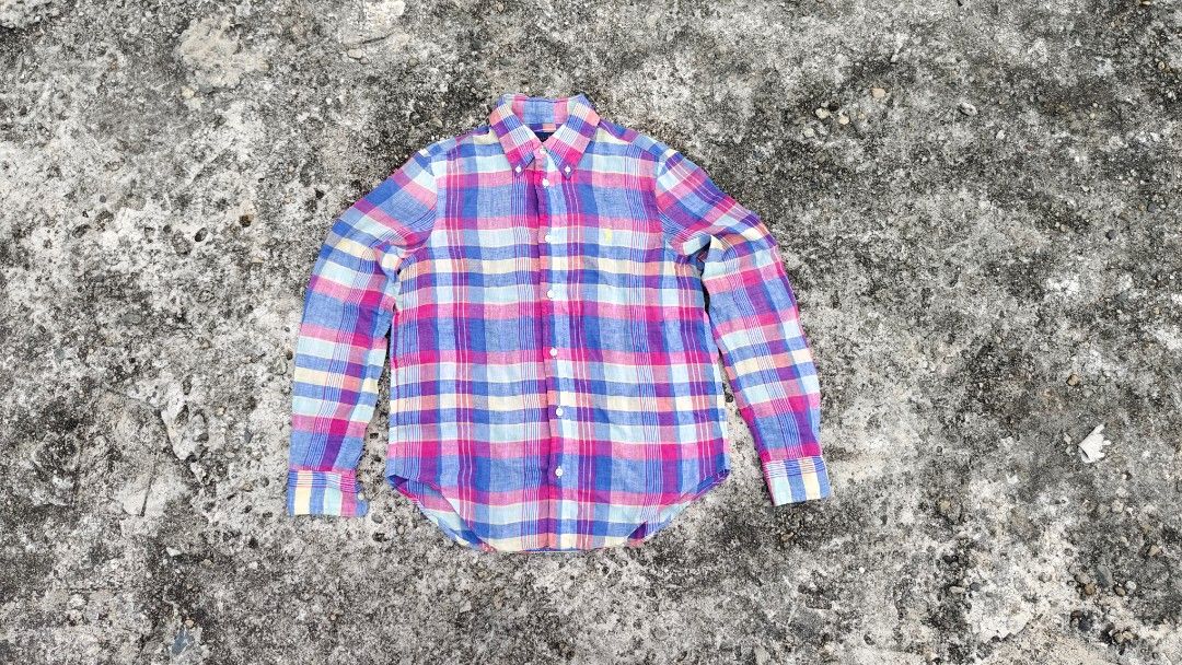 Ralph Lauren Modern plaid Linen Button Shirt (Category: Longsleeves) located in Mati. Submitted by gsthrift (Listing ID 1470362888, Image 1). Description: This long-sleeve button-down shirt is produced by Ralph Lauren, a staple brand in classic American sportswear and preppy heritage style. Crafted from 100% lightweight linen, the garment features an airy, textured weave with an expressive multi-color plaid design in shades of magenta, cornflower