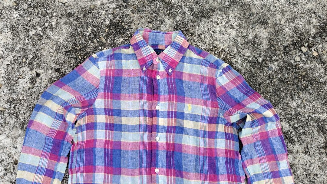 Ralph Lauren Modern plaid Linen Button Shirt (Category: Longsleeves) located in Mati. Submitted by gsthrift (Listing ID 1470362888, Image 3). Description: This long-sleeve button-down shirt is produced by Ralph Lauren, a staple brand in classic American sportswear and preppy heritage style. Crafted from 100% lightweight linen, the garment features an airy, textured weave with an expressive multi-color plaid design in shades of magenta, cornflower
