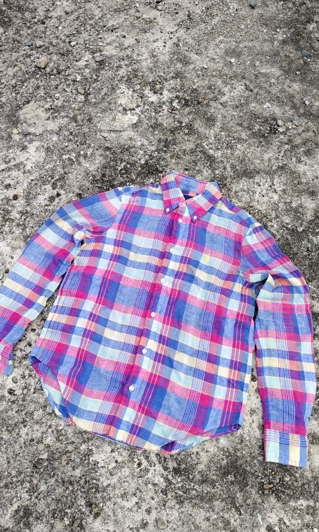 Ralph Lauren Modern plaid Linen Button Shirt (Category: Longsleeves) located in Mati. Submitted by gsthrift (Listing ID 1470362888, Image 2). Description: This long-sleeve button-down shirt is produced by Ralph Lauren, a staple brand in classic American sportswear and preppy heritage style. Crafted from 100% lightweight linen, the garment features an airy, textured weave with an expressive multi-color plaid design in shades of magenta, cornflower