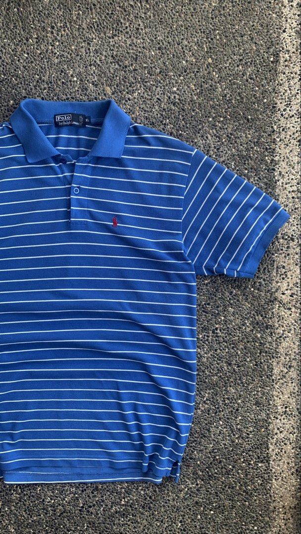 Ralph Lauren Polo (Category: Tshirts & Polo Shirts ) located in Dagupan City. Submitted by upcycle69 (Listing ID 1470446271, Image 2). Description: POLO BY RALPH LAUREN – BLUE STRIPED POLO SHIRT 📌 Details: * Brand: Polo by Ralph Lauren * Size: XL * Color: Blue with White Stripes * Design: Short Sleeve Polo Shirt * Logo: Red Pony Embroidery * Measurements: 22 x 30 inches * Condition: Good Condition * Issues: No issue * Buttons and collar are pres