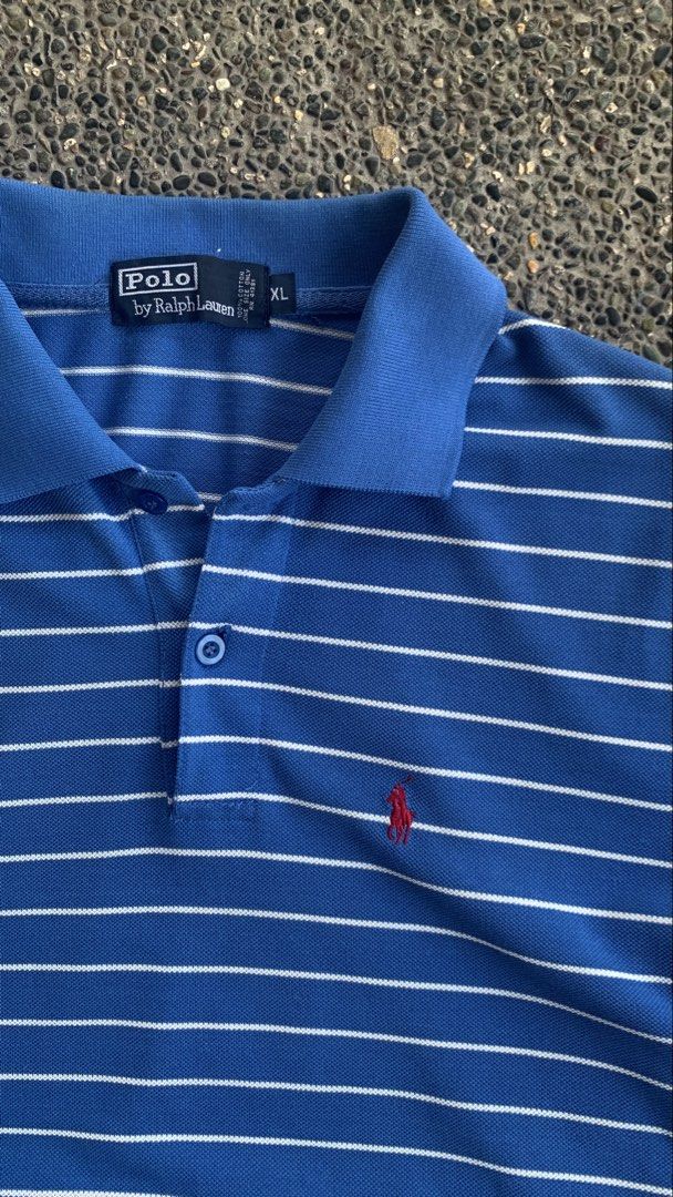 Ralph Lauren Polo (Category: Tshirts & Polo Shirts ) located in Dagupan City. Submitted by upcycle69 (Listing ID 1470446271, Image 3). Description: POLO BY RALPH LAUREN – BLUE STRIPED POLO SHIRT 📌 Details: * Brand: Polo by Ralph Lauren * Size: XL * Color: Blue with White Stripes * Design: Short Sleeve Polo Shirt * Logo: Red Pony Embroidery * Measurements: 22 x 30 inches * Condition: Good Condition * Issues: No issue * Buttons and collar are pres