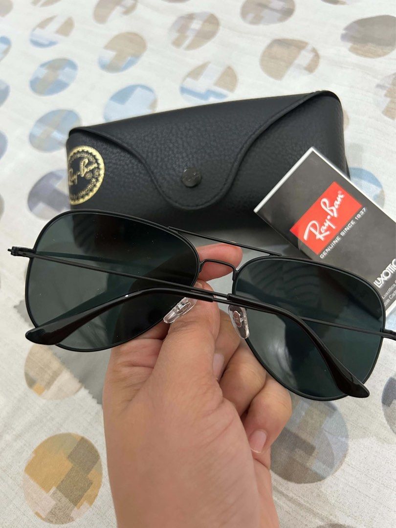 Ray-Ban Aviator Black Sunglasses with Case (Category: Sunglasses & Eyewear) located in Manila. Submitted by ciarabelle (Listing ID 1470396412, Image 2). Description: - Authentic Ray-Ban aviator sunglasses in classic black - Dark lenses with a sleek thin metal frame and double bridge design - Timeless style that easily elevates any everyday outfit - Includes original black leather case, cleaning cloth, and booklet.