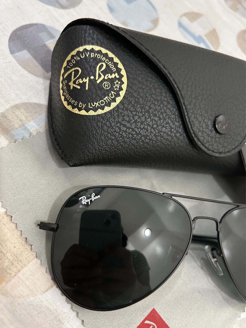 Ray-Ban Aviator Black Sunglasses with Case (Category: Sunglasses & Eyewear) located in Manila. Submitted by ciarabelle (Listing ID 1470396412, Image 3). Description: - Authentic Ray-Ban aviator sunglasses in classic black - Dark lenses with a sleek thin metal frame and double bridge design - Timeless style that easily elevates any everyday outfit - Includes original black leather case, cleaning cloth, and booklet.
