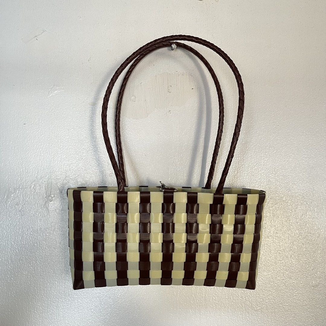 Recycled Plastic Handwoven Bayong Bag (Category: Tote Bags) located in Las Pinas. Submitted by solfits (Listing ID 1470382817, Image 2). Description: • DOT.BASKETWEAVE handmade-style tote bag • Brown and cream checkered plastic weave pattern • Dual braided brown handles for comfortable carrying • Silver clasp closure on top • Lightweight, unlined open compartment • Used only once! Clean exterior and interior 🌀 3.5 x 23 x 12 cm.