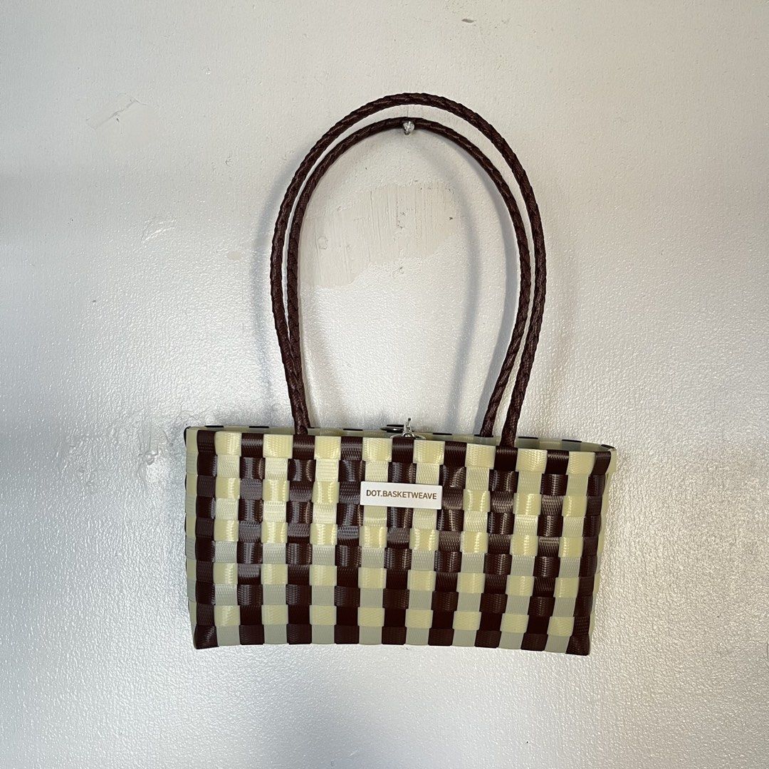 Recycled Plastic Handwoven Bayong Bag (Category: Tote Bags) located in Las Pinas. Submitted by solfits (Listing ID 1470382817, Image 1). Description: • DOT.BASKETWEAVE handmade-style tote bag • Brown and cream checkered plastic weave pattern • Dual braided brown handles for comfortable carrying • Silver clasp closure on top • Lightweight, unlined open compartment • Used only once! Clean exterior and interior 🌀 3.5 x 23 x 12 cm.