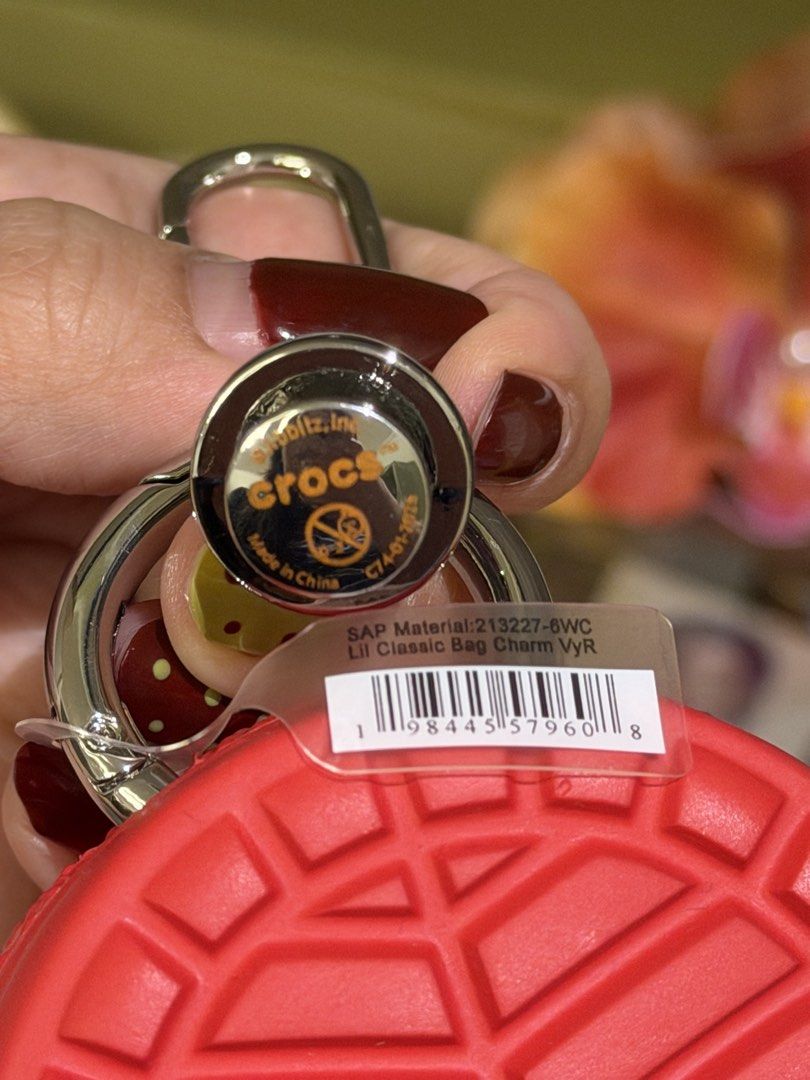 Red Crocs Lil Classic Bag Charm (Croslite Guy character charm) (Category: Character Goods) located in Malolos. Submitted by bg.brnrdo (Listing ID 1470464749, Image 3). Description: - Crocs Lil Classic Bag Charm (also known as the Croslite Guy character charm) in a red colorway - Got this at their physical store in SM North EDSA Annex - Brand new and never used RFS: Decluttering 📍Location: Malolos City, Bulacan 💳 MOP: Gcash/Maribank/Maya 📦 MOD: