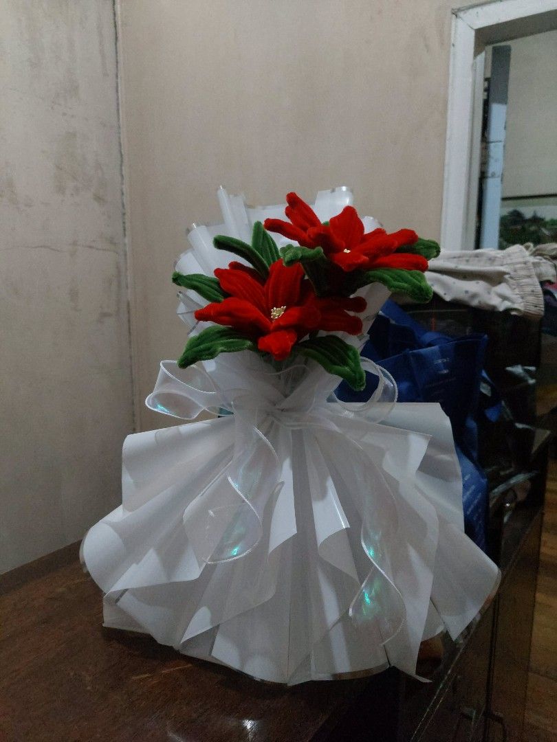 Red Flower Bouquet with White Wrapping (Category: Flowers & Bouquets) located in Manila. Submitted by warmtree_6c8201 (Listing ID 1470489007, Image 1). Description: - Handmade red flower bouquet with velvet-textured petals and green leaves - Elegantly wrapped in layered white pleated paper - Finished with a shiny translucent ribbon - Ideal gift for birthdays, graduations, and holidays - Clean condition and ready to give.