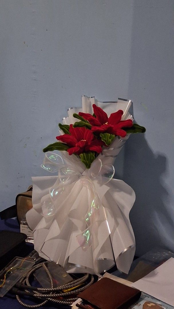 Red Flower Bouquet with White Wrapping (Category: Flowers & Bouquets) located in Manila. Submitted by warmtree_6c8201 (Listing ID 1470489007, Image 2). Description: - Handmade red flower bouquet with velvet-textured petals and green leaves - Elegantly wrapped in layered white pleated paper - Finished with a shiny translucent ribbon - Ideal gift for birthdays, graduations, and holidays - Clean condition and ready to give.