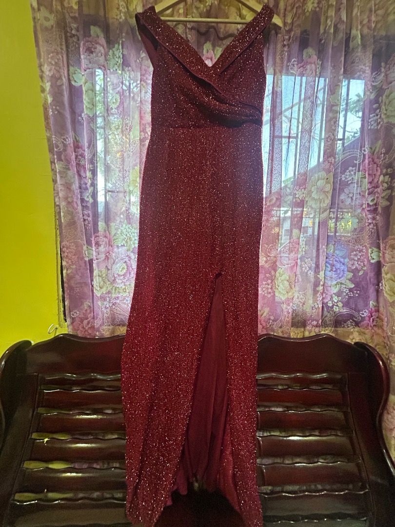 Red Glitter Formal Evening Dress with Front Split (Category: Evening dresses & gowns) located in Quezon City. Submitted by sophieness16 (Listing ID 1470466235, Image 2). Description: - Color: Sparkly red with deep burgundy lining - Design: Floor-length evening dress with high front slit - Neckline: Off-shoulder with wrapped fabric detail - Texture: Fully covered in glitter - Closure: Back zipper - Condition: Excellent/Brand New.