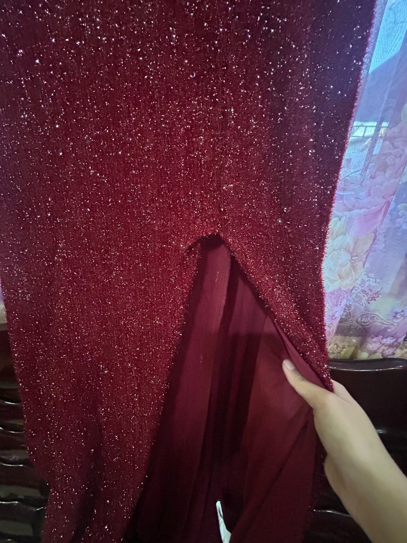 Red Glitter Formal Evening Dress with Front Split (Category: Evening dresses & gowns) located in Quezon City. Submitted by sophieness16 (Listing ID 1470466235, Image 3). Description: - Color: Sparkly red with deep burgundy lining - Design: Floor-length evening dress with high front slit - Neckline: Off-shoulder with wrapped fabric detail - Texture: Fully covered in glitter - Closure: Back zipper - Condition: Excellent/Brand New.