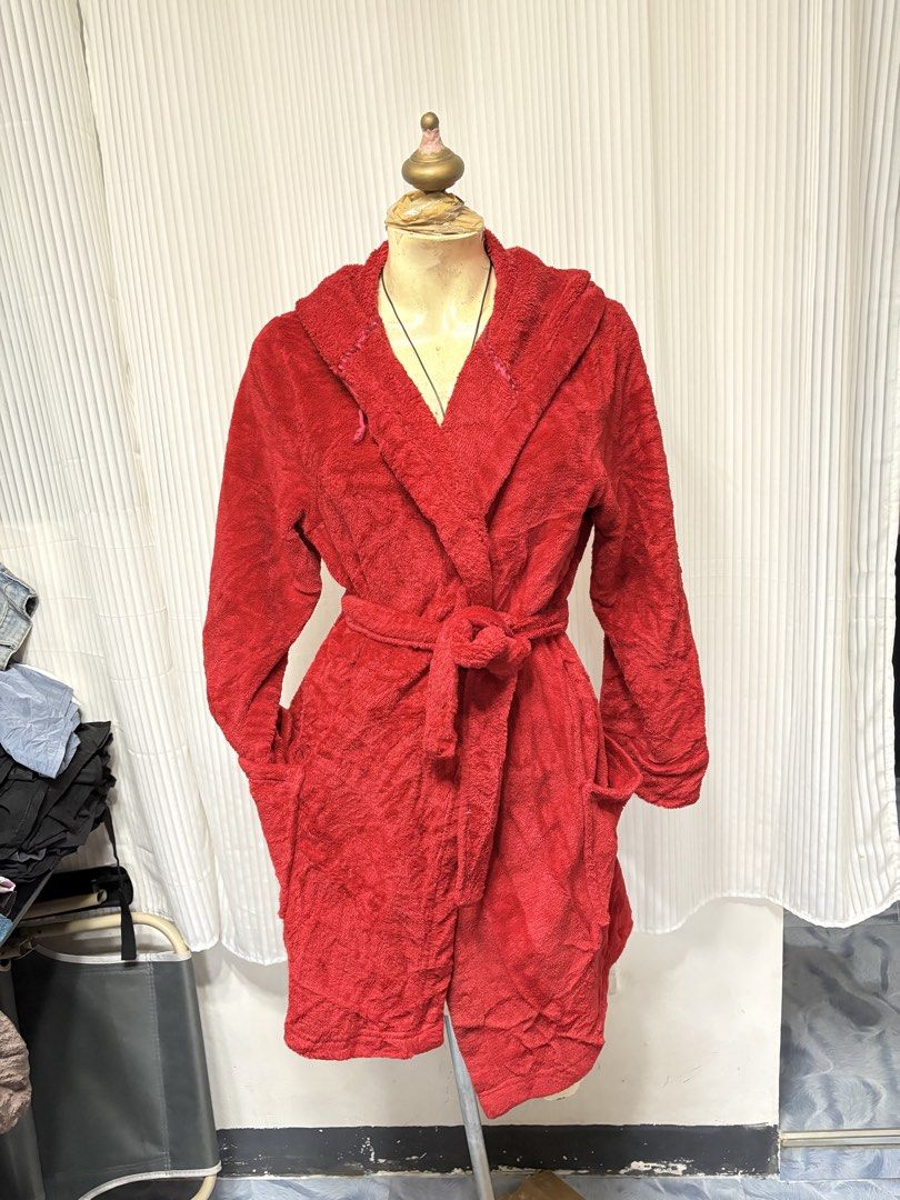Red Plush Hooded Bathrobe with Belt and Pockets (Category: Coats, Jackets and Outerwear) located in General Trias. Submitted by crissy9053136 (Listing ID 1470486841, Image 1). Description: Bright red plush bathrobe. Fluffy fleece material, super cozy and warm. Includes a matching tie belt and two front pockets. Attached hood on the back. Knee-length fit. Great lounge piece for chilly mornings or after a shower..