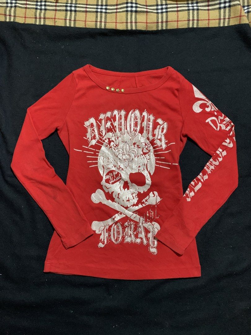 Red Y2K Rhinestone Skull Long Sleeve Top (Category: Longsleeves) located in Cagayan de Oro. Submitted by chabermz (Listing ID 1470532296, Image 1). Description: Bright red long sleeve top with heavy rhinestone embellishments. Huge skull and crossbones graphic on the front with silver glitter print. Gothic font text running down the sleeves. Lace-up grommet detail with rhinestones across the upper back neckline. Crew neck style with small gold stu