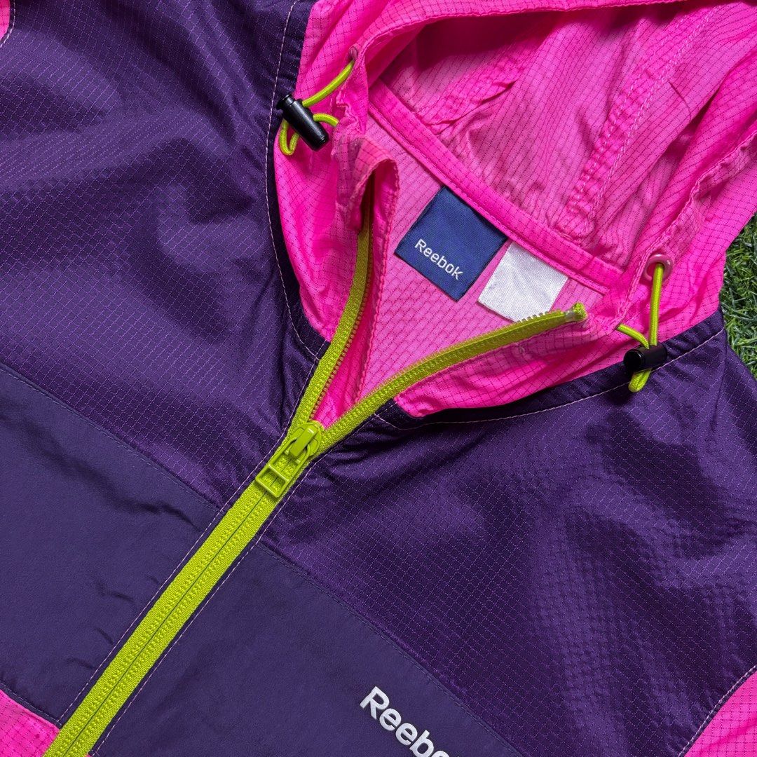 Reebok | Multicolored Windbreaker. (Category: Coats, Jackets and Outerwear) located in Manila. Submitted by bypiecesandstories (Listing ID 1470506158, Image 3). Description: Reebok | Multicolored Windbreaker. 649 PHP 🧡 Perfect Condition Can Fit — X Small to Medium Dimensions — W 19.5" L 26" Lightweight, colorful, and easy to pack, this Reebok windbreaker is a great companion for travel and everyday activities. A sporty looking piece that's pract