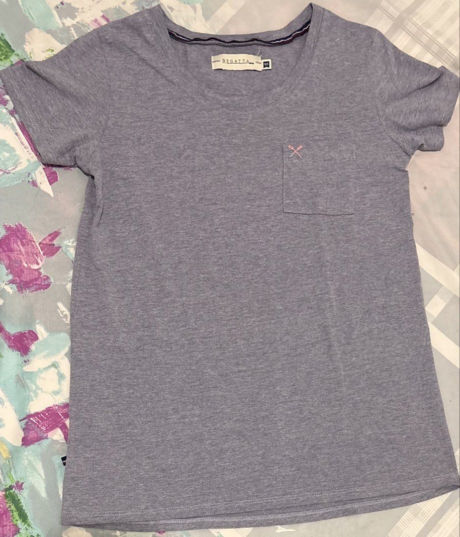 Regatta Grey T-Shirt Size XS (Category: Shirts) located in Manila. Submitted by areiei (Listing ID 1470365417, Image 2). Description: - Brand: Regatta - Size: XS - Color: Grey heathered - Design: Short sleeves, scoop neckline, and striped inner collar trim - Feature: Small chest pocket with a cute pink embroidered crossed arrow logo - Style: Casual basic tee, perfect for everyday outfits Sf Shouldered by Buyer.