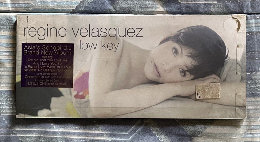 Regine Velasquez Low Key CD Album (Category: CDs & DVDs) located in Marikina City. Submitted by dongv70 (Listing ID 1470556413, Image 1). Description: Regine Velasquez - Low Key ₱ 1,500.00 + Shipping * Inclusions: 2 discs and booklet insert * Condition: Outer slipcase has light shelf wear; discs are clean and play perfectly; Still has the original shrinkwrap * Special Feature: Includes covers and the bonus track 'Christmas Is' with Jim Brickman.