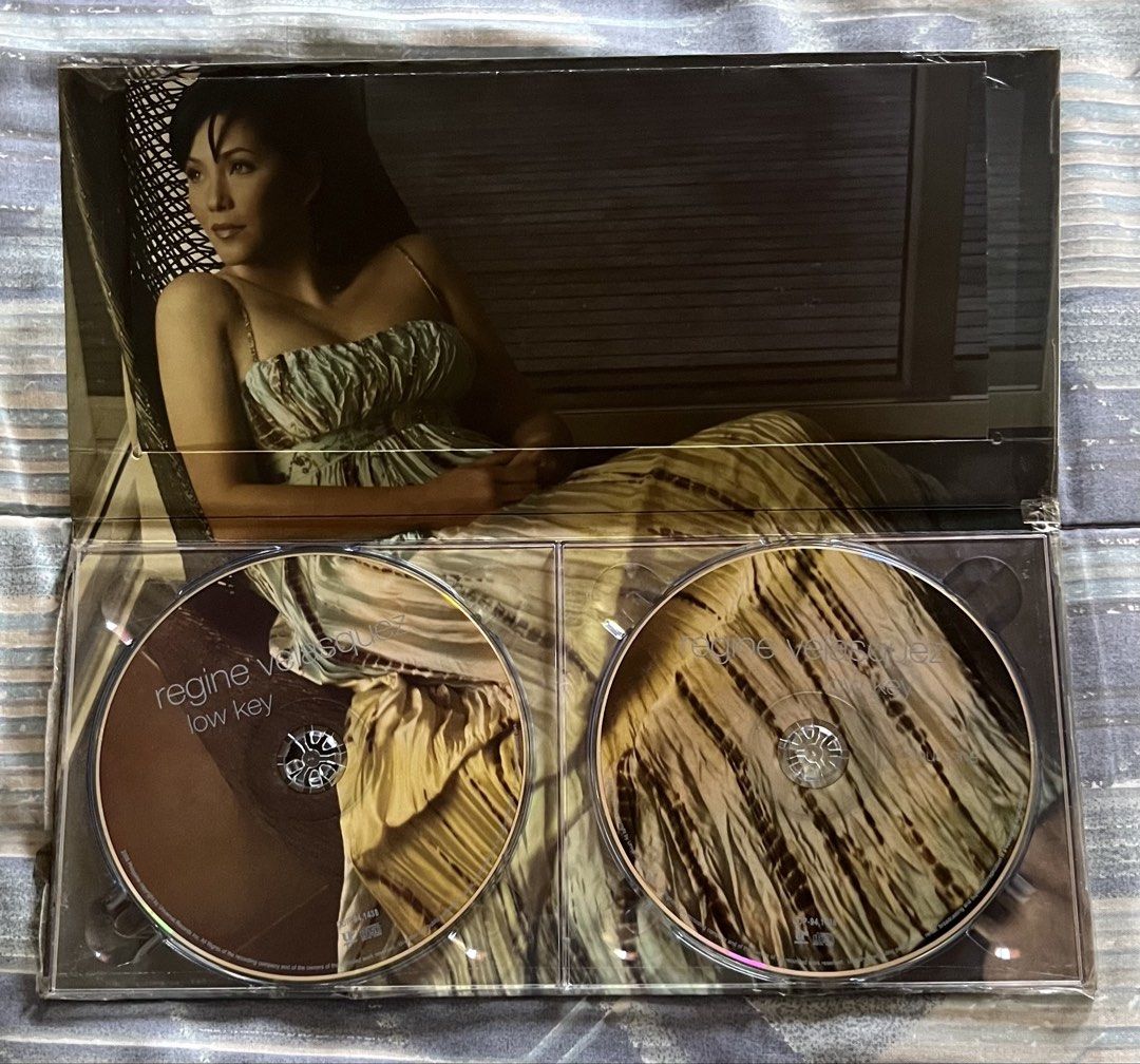 Regine Velasquez Low Key CD Album (Category: CDs & DVDs) located in Marikina City. Submitted by dongv70 (Listing ID 1470556413, Image 3). Description: Regine Velasquez - Low Key ₱ 1,500.00 + Shipping * Inclusions: 2 discs and booklet insert * Condition: Outer slipcase has light shelf wear; discs are clean and play perfectly; Still has the original shrinkwrap * Special Feature: Includes covers and the bonus track 'Christmas Is' with Jim Brickman.