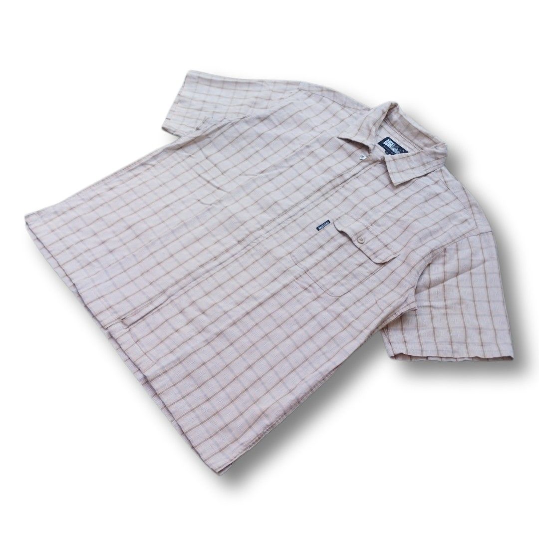Retro Style Plaid Zip-Up Short Sleeve (Category: Tshirts & Polo Shirts ) located in Cavite. Submitted by spinfits (Listing ID 1470428767, Image 2). Description: - Brand: First Down - Size: Medium - Color/Pattern: Cream with a subtle plaid check - Closure: Modern full-zipper front instead of standard buttons - Pockets: Single chest pocket with button flap and woven logo tag - Fabric: Premium textured feel - Condition: Excellent Size: S-M (Width: 2