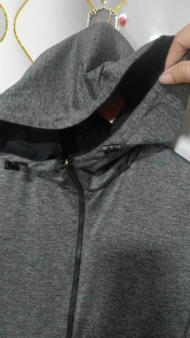 Reversible Grey Heather and Black Hooded Jacket (Category: Coats, Jackets and Outerwear) located in Manila. Submitted by zariyah.1986 (Listing ID 1470456532, Image 3). Description: - Style: 2-in-1 reversible zip jacket - Side A: Cozy grey heather jersey fleece - Side B: Smooth black windbreaker material - Features: Full front zipper, attached adjustable hood, - Fit: Comfortable elastic cuffs and hem - Condition: Brand new / Excellent - Perfect fo