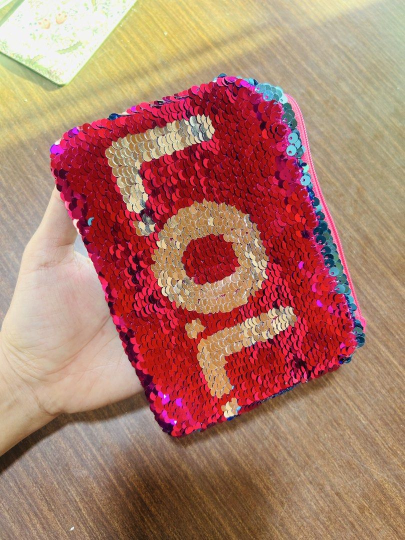 Reversible Sequin LOL Pouch Pink and Teal (Category: Purses & Pouches) located in Manila. Submitted by starbalesukandjapansurplus (Listing ID 1470555717, Image 2). Description: - Fun reversible sequin pouch with LOL lettering - Dual-color design: flip from teal to hot pink sequins - Secure zip top closure with bright pink inner lining - Versatile use for stationery, makeup, or small accessories.