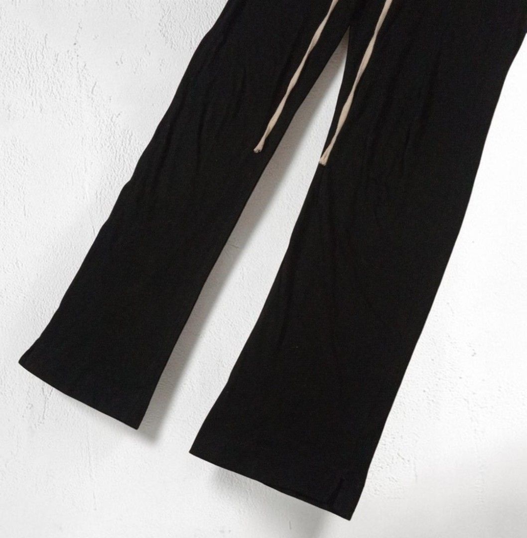 Rick Owens - DrkShdw Drawstring Prisoner Pants (Category: Joggers) located in Manila. Submitted by grmnts_frmthe_slmz (Listing ID 1470395078, Image 3). Description: Black cotton sweatpants with long beige drawstring cords. Elastic waistband, straight leg cut. Clean hem at the bottom with a small side slit. Super relaxed fit, daily wear staple. W 15 inches Crtch 10 inches Insm 30 inches L 41 inches LgOpng 8.5 inches Origin: Italy Materials: Cotton
