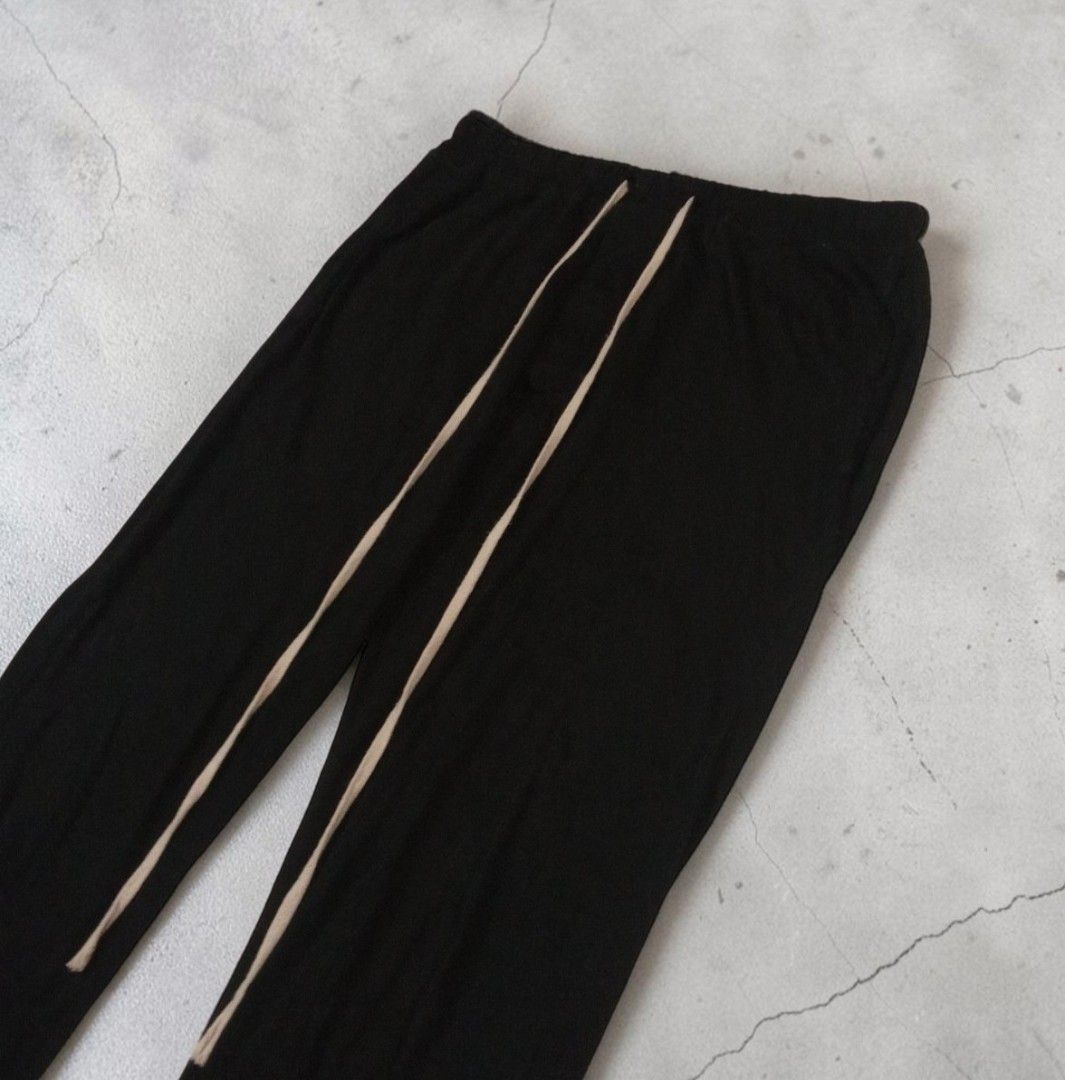 Rick Owens - DrkShdw Drawstring Prisoner Pants (Category: Joggers) located in Manila. Submitted by grmnts_frmthe_slmz (Listing ID 1470395078, Image 2). Description: Black cotton sweatpants with long beige drawstring cords. Elastic waistband, straight leg cut. Clean hem at the bottom with a small side slit. Super relaxed fit, daily wear staple. W 15 inches Crtch 10 inches Insm 30 inches L 41 inches LgOpng 8.5 inches Origin: Italy Materials: Cotton