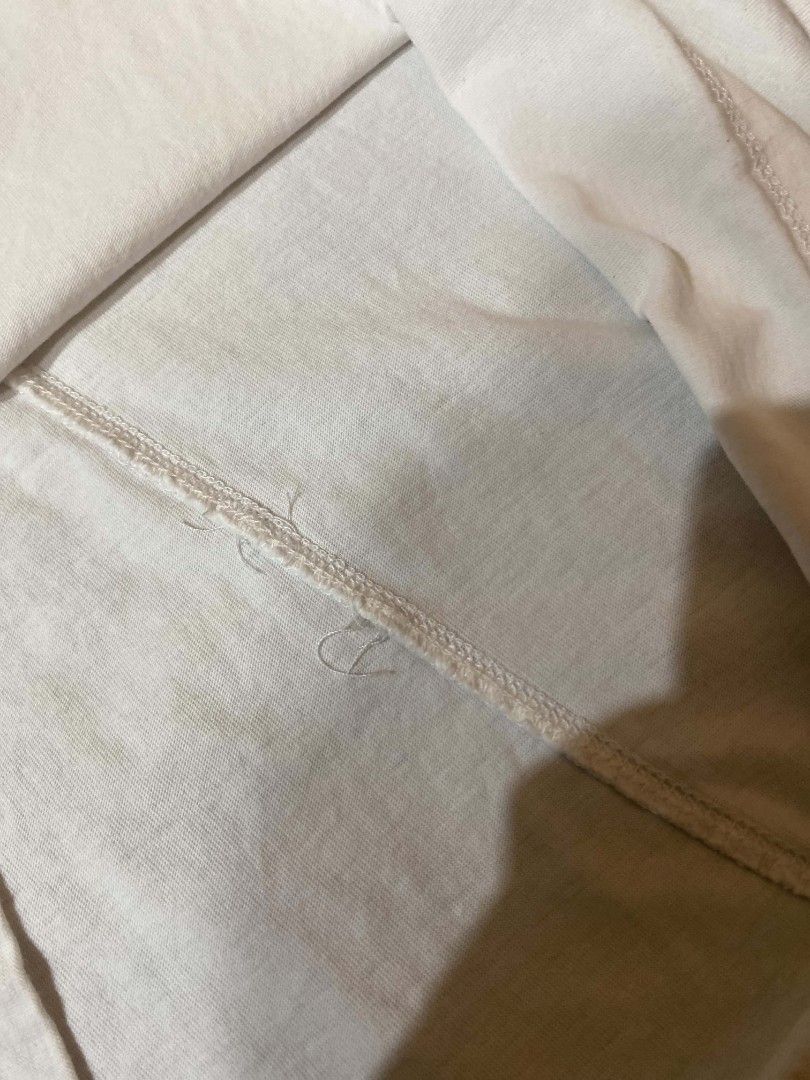 Rick Owens White Basic T-shirt (Category: Shirts) located in Manila. Submitted by thrift_sta.20 (Listing ID 1470372101, Image 3). Description: - Brand: Rick Owens - Color: Classic White - Material: Lightweight, breathable cotton - Design: Crewneck with signature vertical back seam and twin neckline loops - Fit: Short sleeves with a straight hemline - Style: Minimalist luxury staple, perfect for everyday wear.