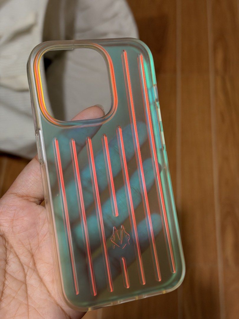 Rimowa Iridiscent case Iphone 15Pro (Category: Cases & Sleeves) located in Manila. Submitted by oggoodsph (Listing ID 1470524840, Image 2). Description: Case only Natambak lang hindi nagamit For Iphone 15Pro.