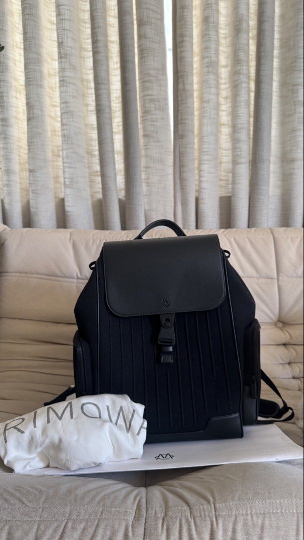 Rimowa Never Still Backpack Black Canvas (Category: Backpacks) located in Quezon City. Submitted by shopwitheika (Listing ID 1470386916, Image 1). Description: Includes dust bag and paper bag Key Features & Design • Materials: Durable canvas exterior accented with full-grain leather, a soft textile interior, and palladium-colored hardware. • Closure & Hardware: Secured by a bespoke speed clip buckle featuring the RIMOWA monogram, combined with a 