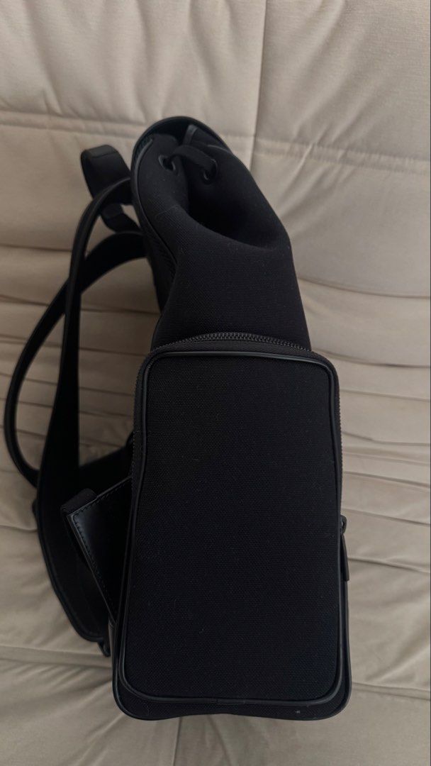Rimowa Never Still Backpack Black Canvas (Category: Backpacks) located in Quezon City. Submitted by shopwitheika (Listing ID 1470386916, Image 3). Description: Includes dust bag and paper bag Key Features & Design • Materials: Durable canvas exterior accented with full-grain leather, a soft textile interior, and palladium-colored hardware. • Closure & Hardware: Secured by a bespoke speed clip buckle featuring the RIMOWA monogram, combined with a 
