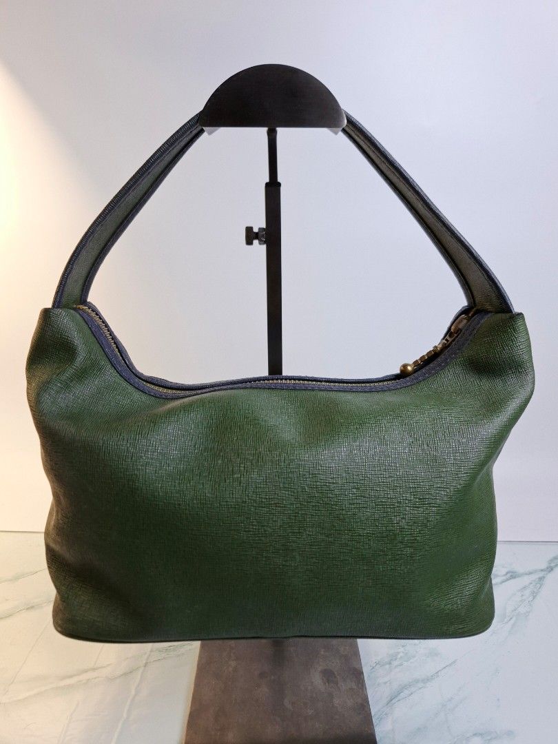 Roberta di Camerino Green Shoulder Bag (Category: Luxury Bags & Wallets) located in Pasay City. Submitted by onick_79 (Listing ID 1470415393, Image 2). Description: -Dimensions: L30 x H 15 x W 13 cm - Brand: Roberta di Camerino - Style: Green shoulder bag with single handle - Material: Textured faux leather with brass-tone hardware - Design: Iconic embroidered R belt motif and brand lettering on front - Interior: Clean lining with a convenient zi
