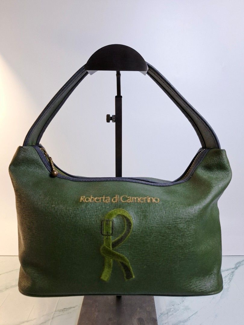 Roberta di Camerino Green Shoulder Bag (Category: Luxury Bags & Wallets) located in Pasay City. Submitted by onick_79 (Listing ID 1470415393, Image 1). Description: -Dimensions: L30 x H 15 x W 13 cm - Brand: Roberta di Camerino - Style: Green shoulder bag with single handle - Material: Textured faux leather with brass-tone hardware - Design: Iconic embroidered R belt motif and brand lettering on front - Interior: Clean lining with a convenient zi
