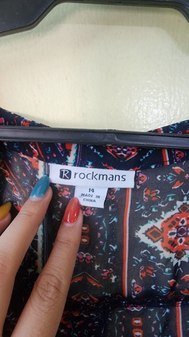 Rockmans Navy Patterned Long Sleeve Cardigan Size 14 (Category: Coats, Jackets and Outerwear) located in Quezon City. Submitted by amenohana (Listing ID 1470356772, Image 2). Description: - Brand: Rockmans - Size: 14 - Color: Navy blue with orange, white, and pink tribal/geometric print - Material: Lightweight chiffon-like fabric - Design: Open front, long sleeves, flowy hemline - Condition: Great layering piece for casual outfits - Country of Or