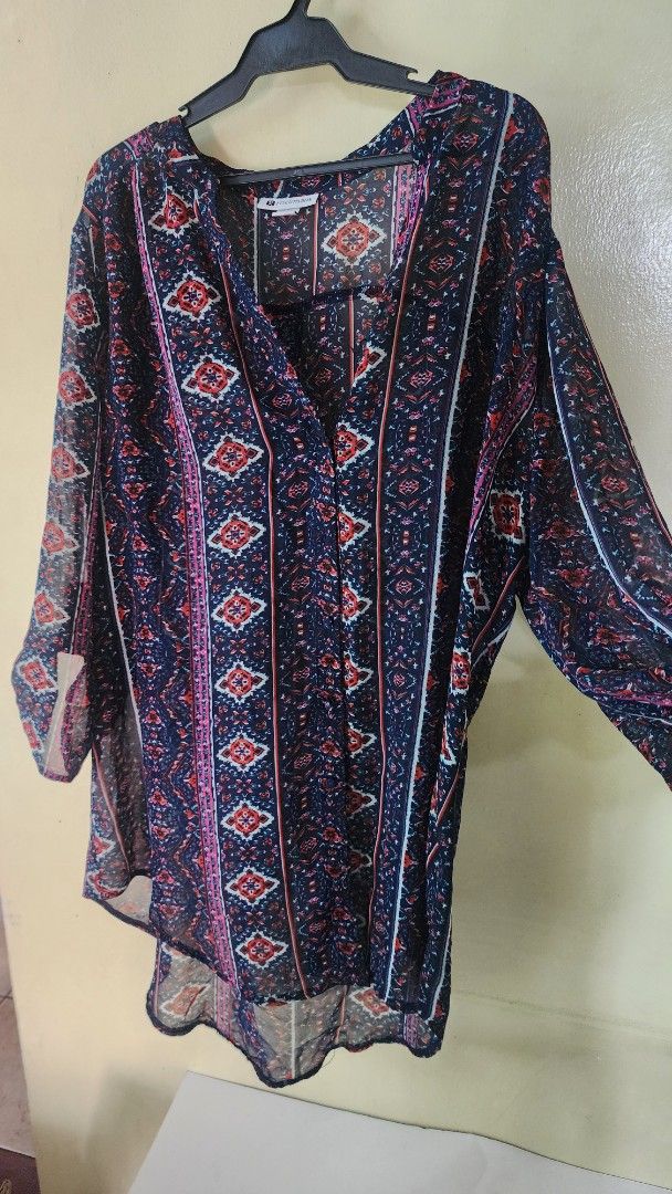 Rockmans Navy Patterned Long Sleeve Cardigan Size 14 (Category: Coats, Jackets and Outerwear) located in Quezon City. Submitted by amenohana (Listing ID 1470356772, Image 3). Description: - Brand: Rockmans - Size: 14 - Color: Navy blue with orange, white, and pink tribal/geometric print - Material: Lightweight chiffon-like fabric - Design: Open front, long sleeves, flowy hemline - Condition: Great layering piece for casual outfits - Country of Or