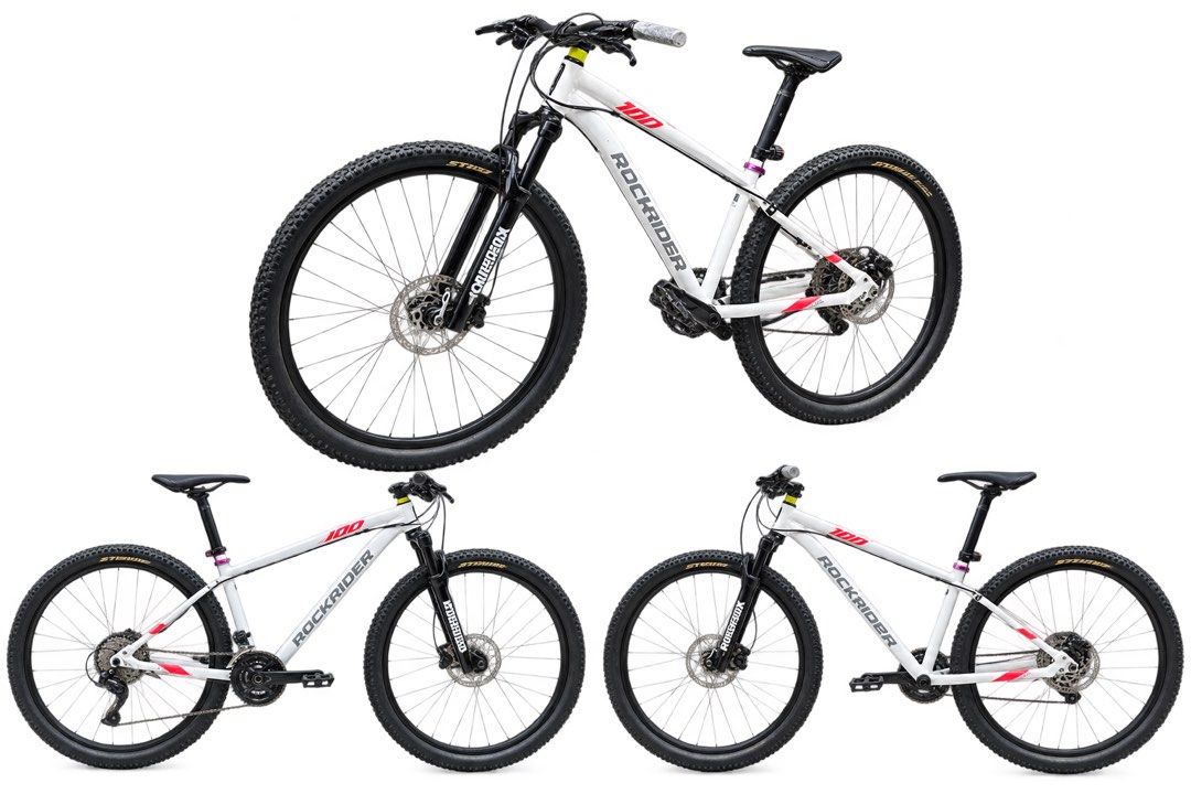 Mountain Bike (Category: Bicycles) located in Taytay. Submitted by cris-ann (Listing ID 1470358612, Image 1). Description: - Brand/Model: Rockrider 100 Mountain Bike - Color: White frame with red accents - Brakes: Hydraulic disc brakes for reliable stopping power - Suspension: Front suspension fork for smooth trail riding - Drivetrain: Multi-speed setup with black wheels and knobby tires - Comfort: Adjustable seat post and standard handlebars - C