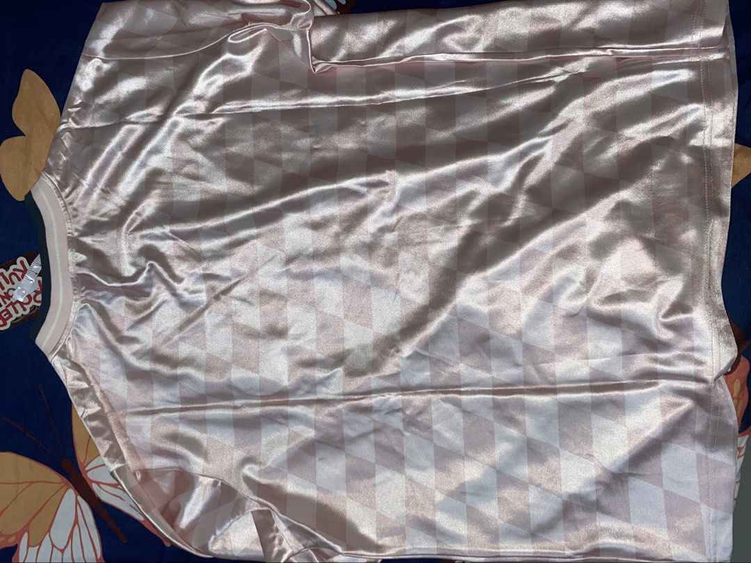 Roller on Ruller Pink Checkered Jersey Size XL (Category: Activewear) located in Bacoor. Submitted by zzallys (Listing ID 1470508395, Image 3). Description: - Brand: Roller on Ruller - Size: XL (with original paper hang tag) - Design: Light pink checkered pattern with V-neck and dark grey/white striping - Details: CE SQUAD front graphic, 8-28 football patch, and three yellow stars - Condition: Brand new, never worn.